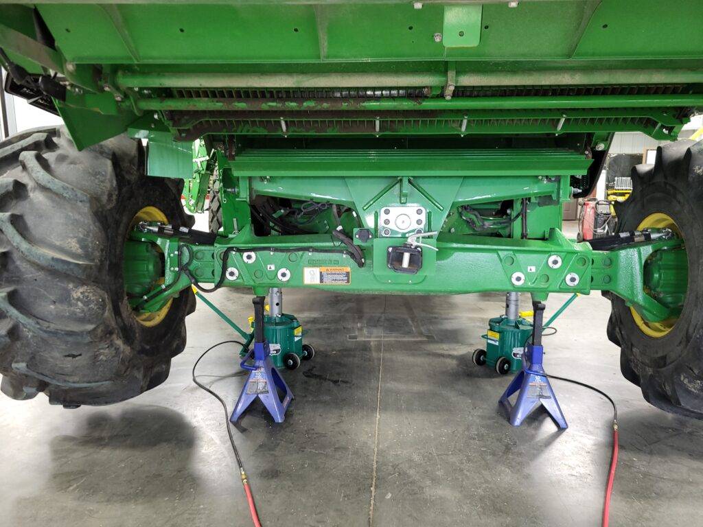 Stock John Deere rear axle on an X9 combine before Hillco Leveling System installation